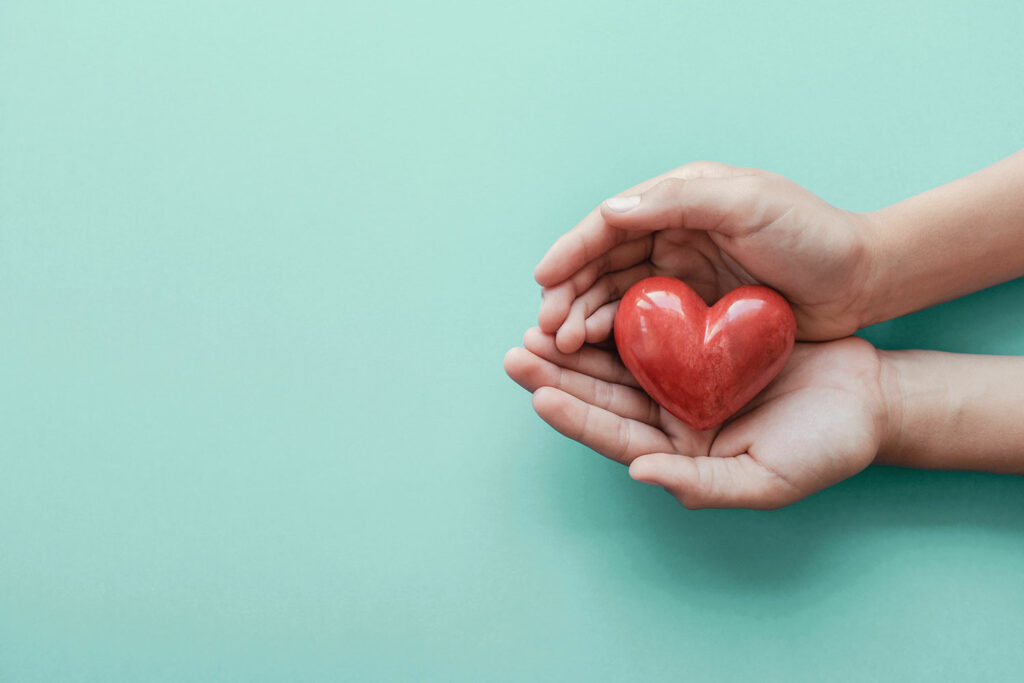 heart ornament in someones hands