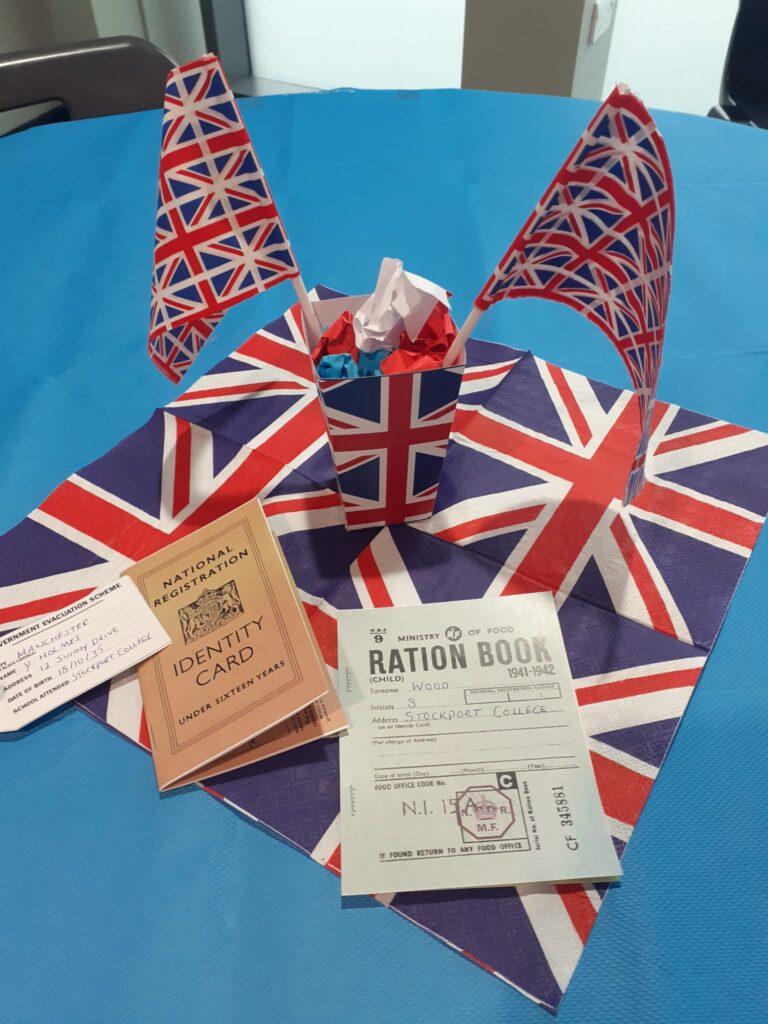 British flags with old ration book and identity card samples